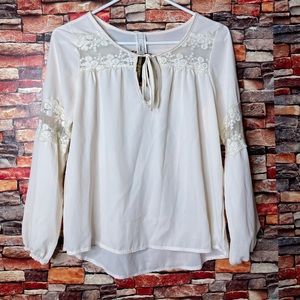 Elegant white blouse with lace